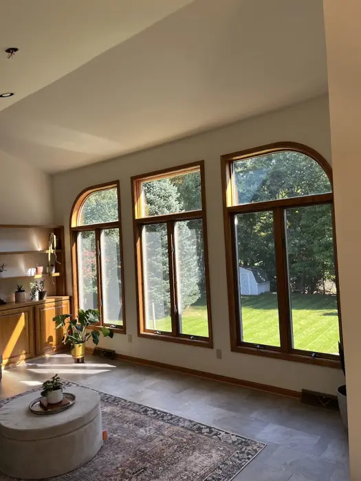 Bright great room with tall arched windows